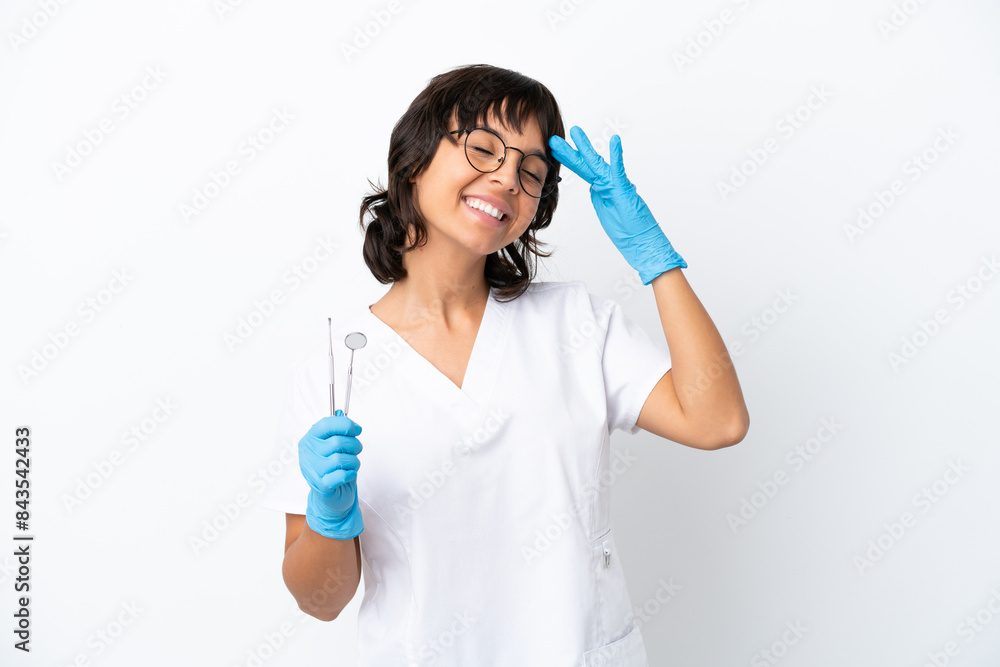 Young woman holding tools isolated on white background smiling a lot Young woman holding tools isolated on white background smiling a lot