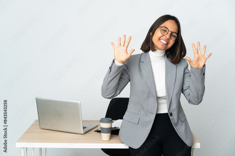 Young latin business woman working in a office isolated on white background counting ten with fingers Young latin business woman working in a office isolated on white background counting ten with fingers