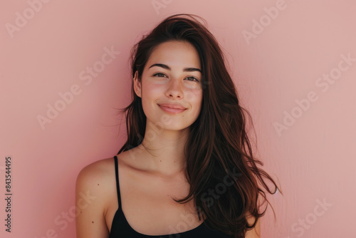 A close up portrait of a young woman with a subtle smile © MagnusCort