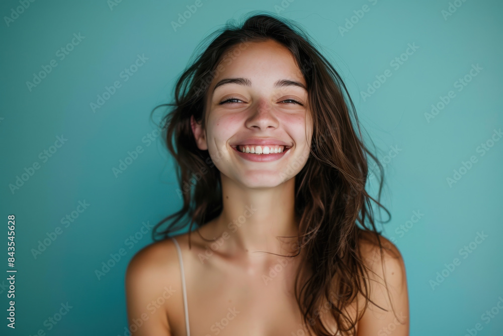 A close up portrait of a young woman with a subtle smile A close up portrait of a young woman with a subtle smile