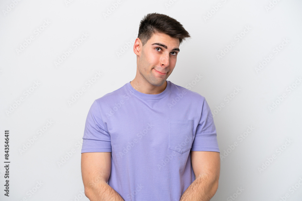 Young caucasian man isolated on white background having doubts while looking up Young caucasian man isolated on white background having doubts while looking up