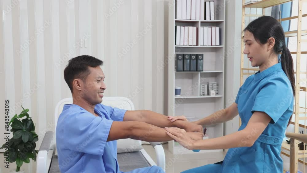 Woman on physiotherapy table lying on the side. Professional physician is massaging back of women , manual therapy and osteopathy Woman on physiotherapy table lying on the side. Professional physician is massaging back of women , manual therapy and osteopathy