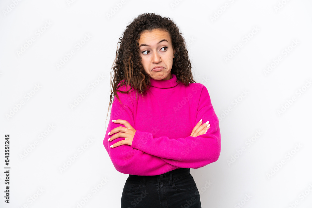 Young Arab woman isolated on white background making doubts gesture while lifting the shoulders Young Arab woman isolated on white background making doubts gesture while lifting the shoulders