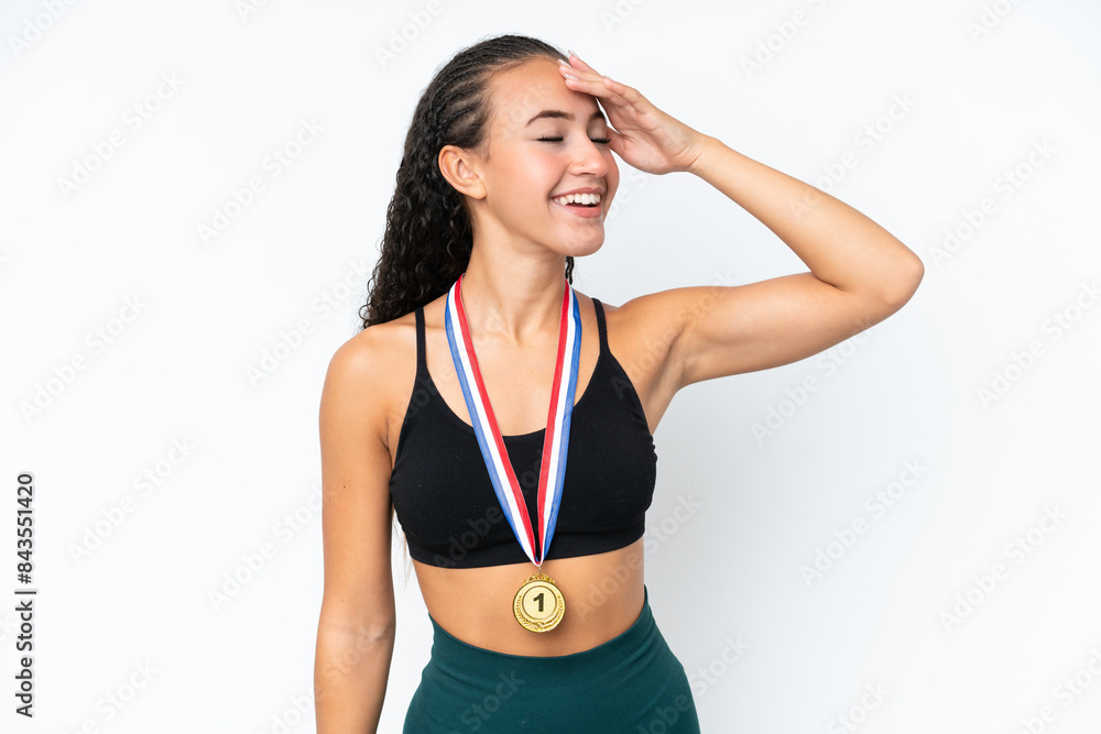 Young sport woman with medals isolated on white background has realized something and intending the solution Young sport woman with medals isolated on white background has realized something and intending the solution
