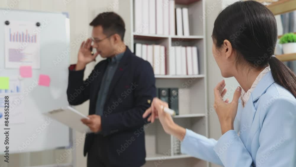 Asian businessmen and businesswomen meet to brainstorm with colleagues on a new project document working together to plan success. Asian businessmen and businesswomen meet to brainstorm with colleagues on a new project document working together to plan success.