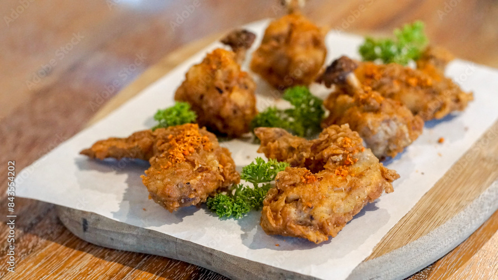 Fried chicken wings garnished with parsley Fried chicken wings garnished with parsley
