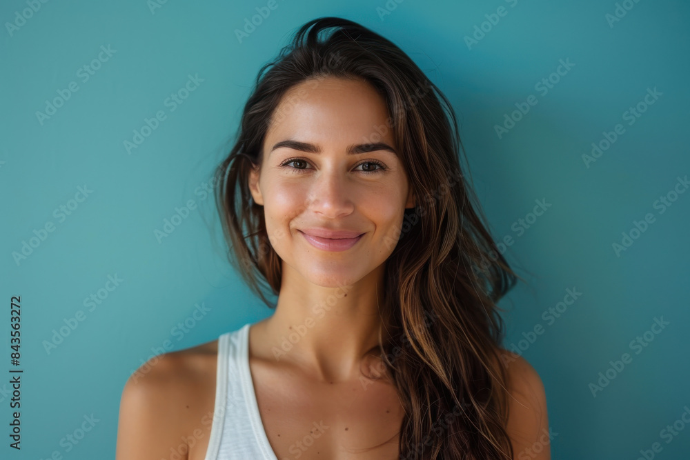 A close up portrait of a young woman with a subtle smile A close up portrait of a young woman with a subtle smile
