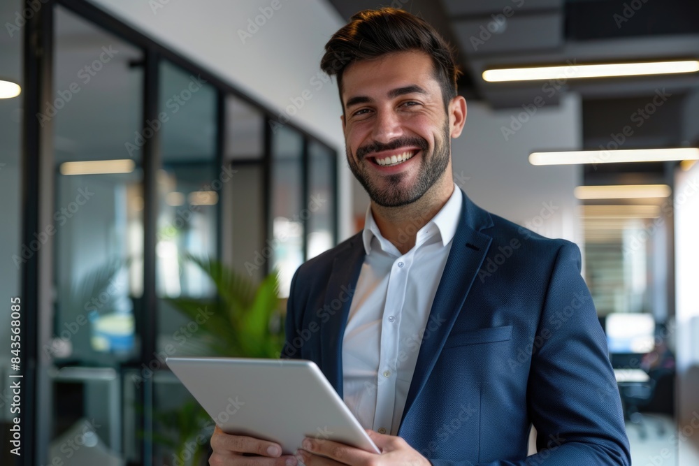 Smiling young business standing in a modern office. Smiling young business standing in a modern office.