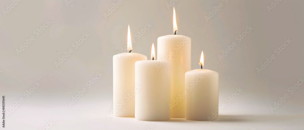 A serene arrangement of five white candles illuminated against a minimalist backdrop, evoking calm and tranquility. A serene arrangement of five white candles illuminated against a minimalist backdrop, evoking calm and tranquility.