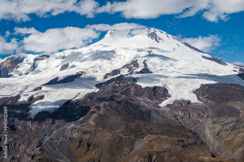 Snowy peak of Mount Elbrus in spring. Caucasus mountains. Kabardino-Balkaria Reublic. Panorama of Elbrus. photo