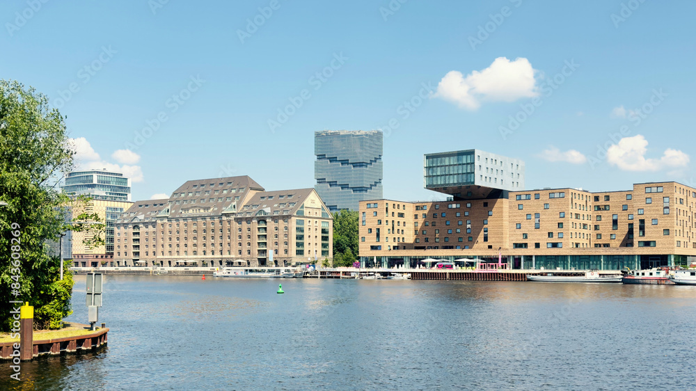 Fototapeta premium waterside urban scene with modern and historic buildings