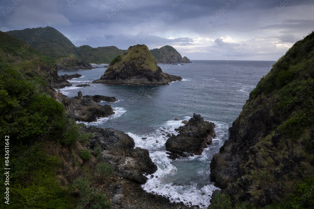 Rocky outcrops and cliffs at the scenic coast of an tropical Lombok island in Indonesia archipelago Rocky outcrops and cliffs at the scenic coast of an tropical Lombok island in Indonesia archipelago