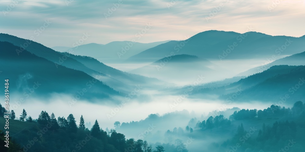 A panoramic view of a mist-covered woodland landscape, with mountains, trees, and a serene sunrise. A panoramic view of a mist-covered woodland landscape, with mountains, trees, and a serene sunrise.