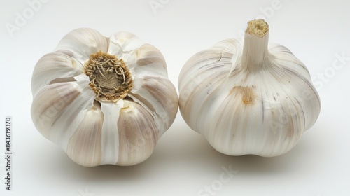 Two Whole Garlic Bulbs Isolated on White Background photo