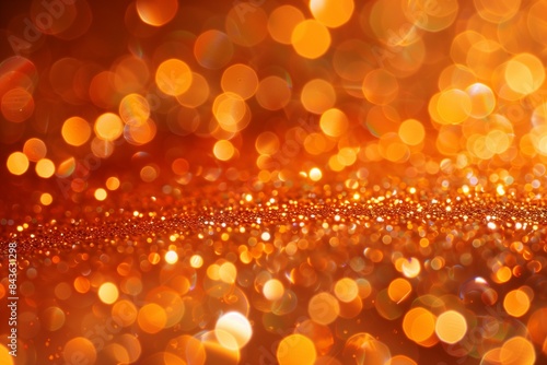 A luxurious background featuring orange glitter and bokeh lights, ideal for upscale and festive designs.