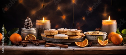 Freshly Baked Mince Pies On Table Set For Christmas With Cinnamon Sticks And Orange. copy space available