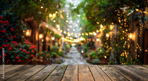 Wooden Table with Blurred Festive Lights. Summer Evening, Terrace, Holiday Decor © LiliGraphie
