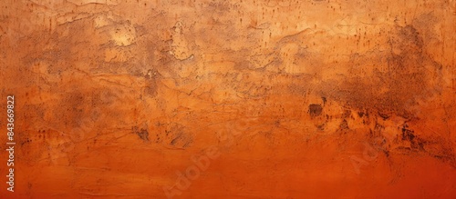 Golden decorative texture for plaster or concrete abstract reddish orange painted stucco wall background natural light with a shiny crackle pattern. copy space available photo