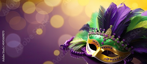 A festive Mardi Gras masquerade with a vibrant Venetian mask fan displayed against a striking purple background The aerial view reveals a joyful Mardi Gras background with ample copy space Celebratin