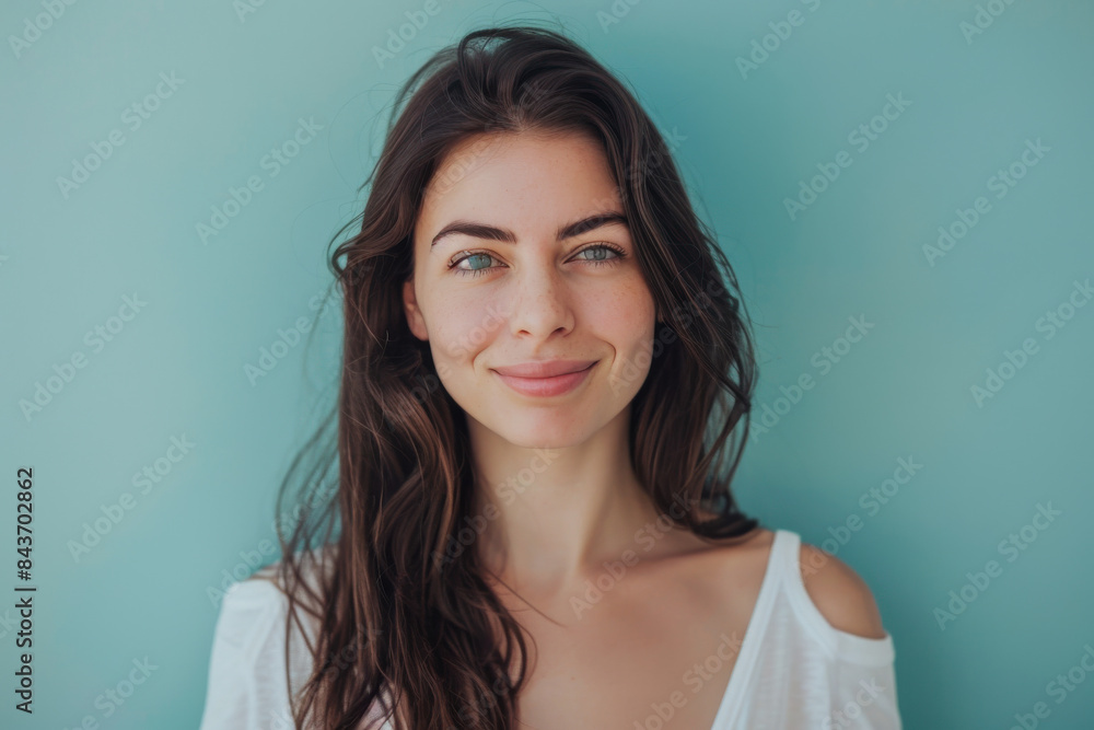 A close up portrait of a young woman with a subtle smile A close up portrait of a young woman with a subtle smile