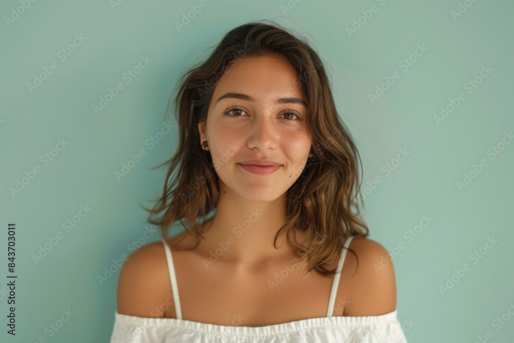 A close up portrait of a young woman with a subtle smile A close up portrait of a young woman with a subtle smile