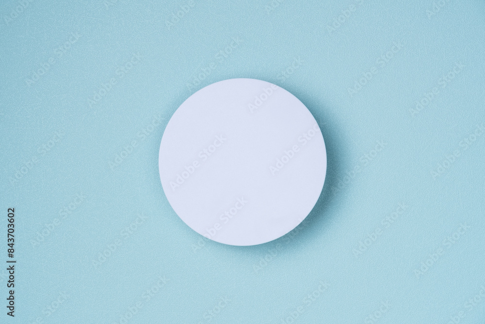 White round podium, pedestal product, presentation empty mockup on blue background White round podium, pedestal product, presentation empty mockup on blue background