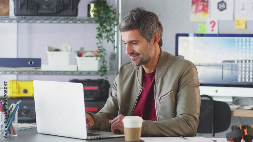 Portrait of smiling couple working as fashion designers in studio with tape measure and digital tablet - shot in slow motion Portrait of smiling couple working as fashion designers in studio with tape measure and digital tablet - shot in slow motion