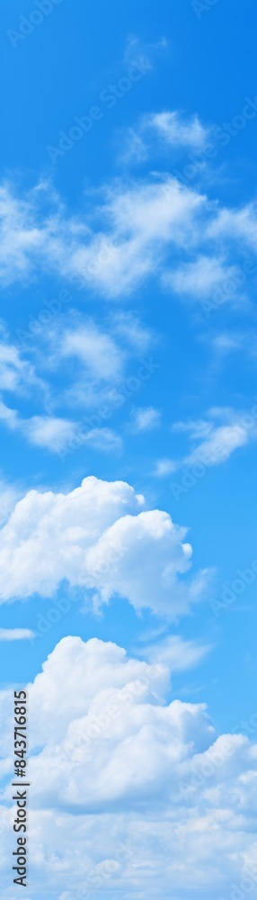 Bright blue sky with fluffy white clouds. Perfect for background or landscape projects needing a serene, natural, and calming atmosphere. Bright blue sky with fluffy white clouds. Perfect for background or landscape projects needing a serene, natural, and calming atmosphere.