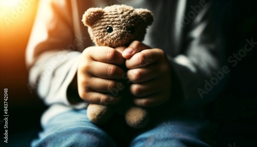 Child Holding Teddy Bear Representing Comfort and Emotional Support