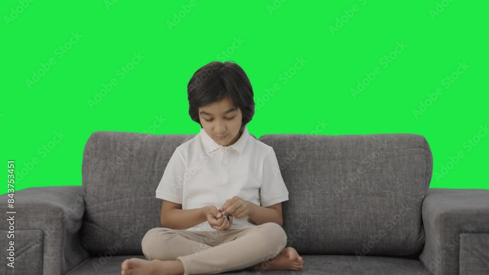 Happy Indian boy counting money coins Green screen Happy Indian boy counting money coins Green screen