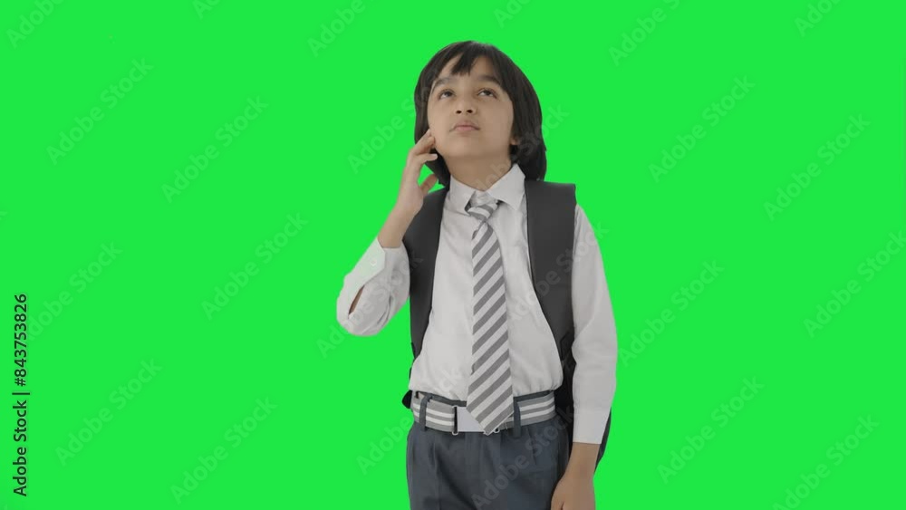 Confused Indian school boy thinking Green screen
