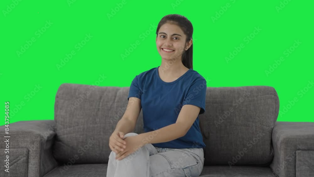 Happy Indian teenage girl smiling to the camera Green screen Happy Indian teenage girl smiling to the camera Green screen