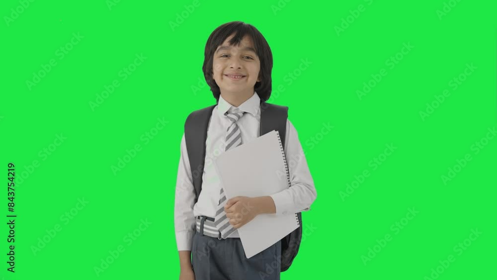 Indian school boy standing with books Green screen Indian school boy standing with books Green screen