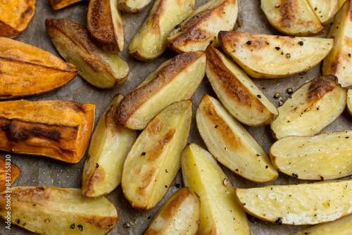 Crispy oven-baked potatoes. Delicious potatoes with for dinner just out of the oven