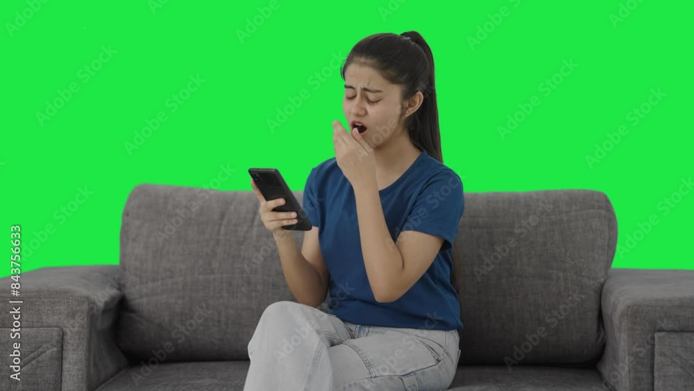 Lazy Indian teenage girl scrolling phone Green screen Lazy Indian teenage girl scrolling phone Green screen