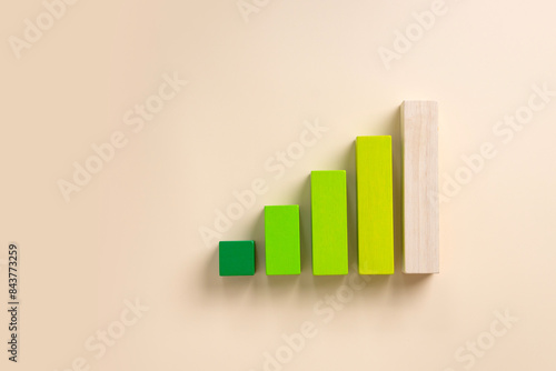 Ascending bars - symbolic of graph on cream colour background.