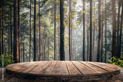 A rustic wooden platform in front of a misty  sun-dappled forest. The peaceful scene is perfect for product displays.