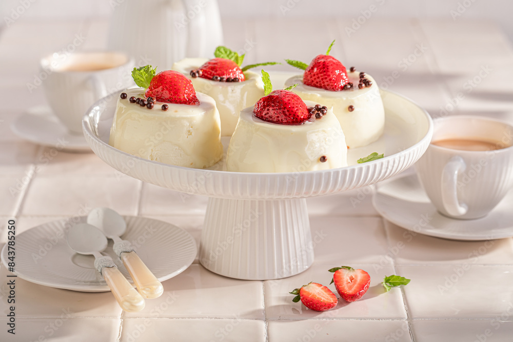 Tasty cheesecake monoportion with strawberries and vanilla glazed. Tasty cheesecake monoportion with strawberries and vanilla glazed.