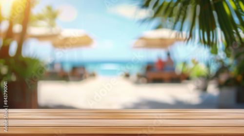 Fototapeta Naklejka Na Ścianę i Meble -  Tropical beach bar background. Wooden table top with blurred background of beach bar, perfect for product placement or summer theme design.