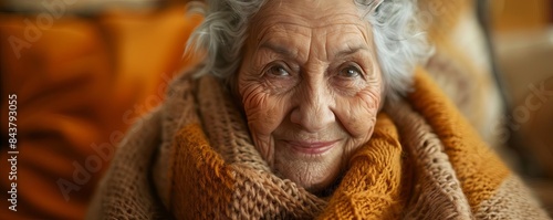 Elderly woman smiling, wrinkles showcasing a lifetime of joy, warm colors photo