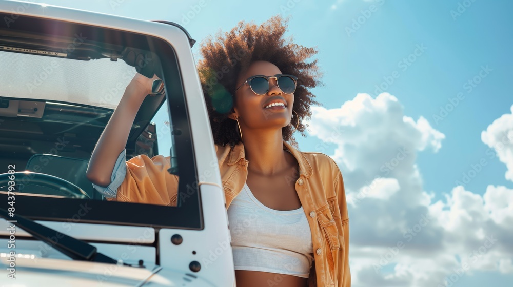 Naklejka premium Happy woman standing next to white SUV and looking at the sky