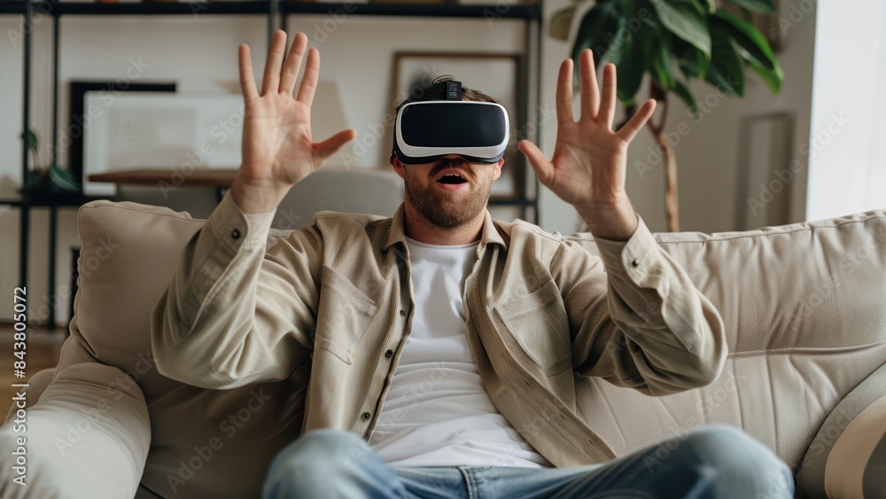 a man acting excited and surprised while watching something in his VR headset a man acting excited and surprised while watching something in his VR headset