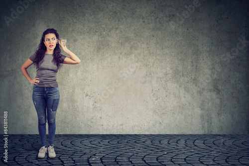 woman listening to a secret conversation 