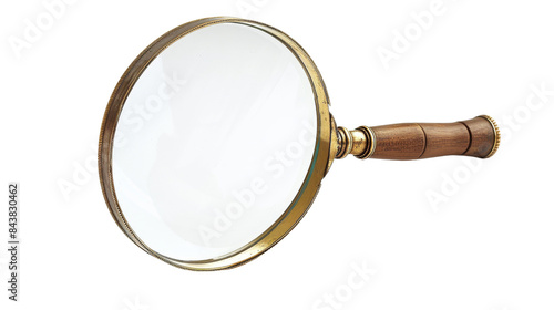 A classic magnifying glass with a brass frame and wooden handle, isolated on a black background.