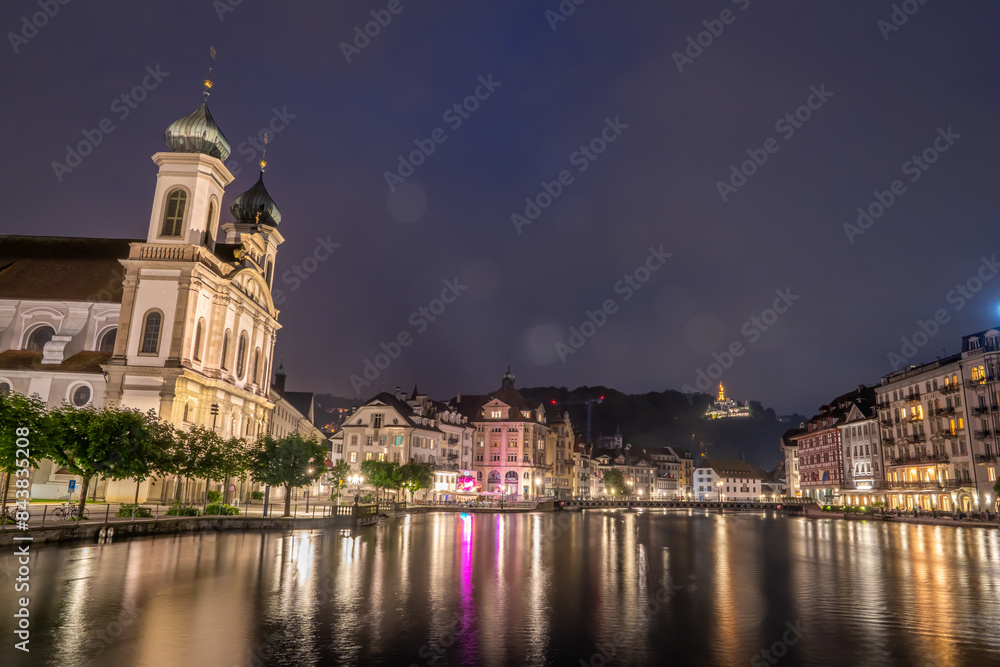Obraz premium Night view of chapel bridge ,jesuitenkirche in old town are very famous and beautiful landscape in Luzern Switzerland 