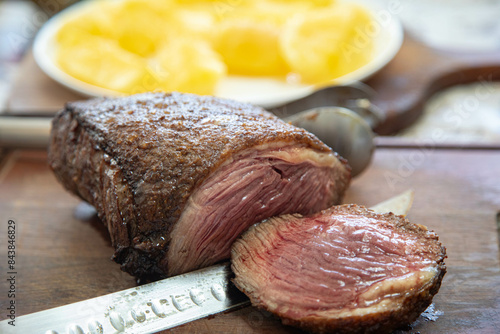 Grassfeed beef known as picanha, roasted and rare, the best meat in the world for barbecue photo