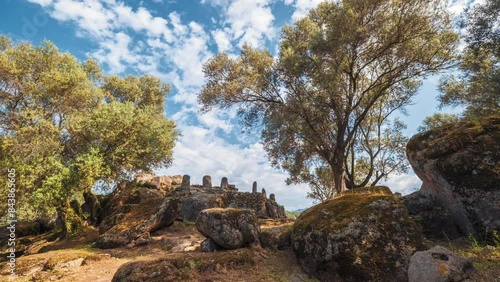 Time-lapse of clouds passing the prehistoric menhirs or standing stones at Filitosa in Corsica photo