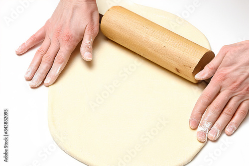 use of rolling pin to prepare pizza dough