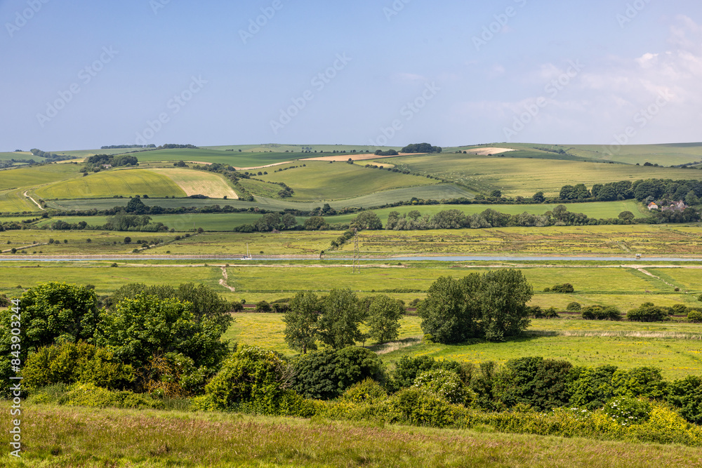 Fototapeta premium A view over the South Downs with the River Ouse in the Valley below, on a sunny summer's day