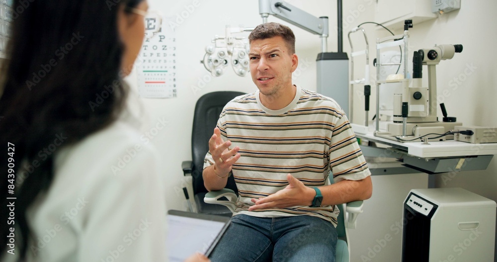 Obraz premium Doctor, ophthalmologist and consultation with man in clinic or angry patient confused at eye health diagnosis. Optometry, test and professional on tablet technology for wellness, vision and talking